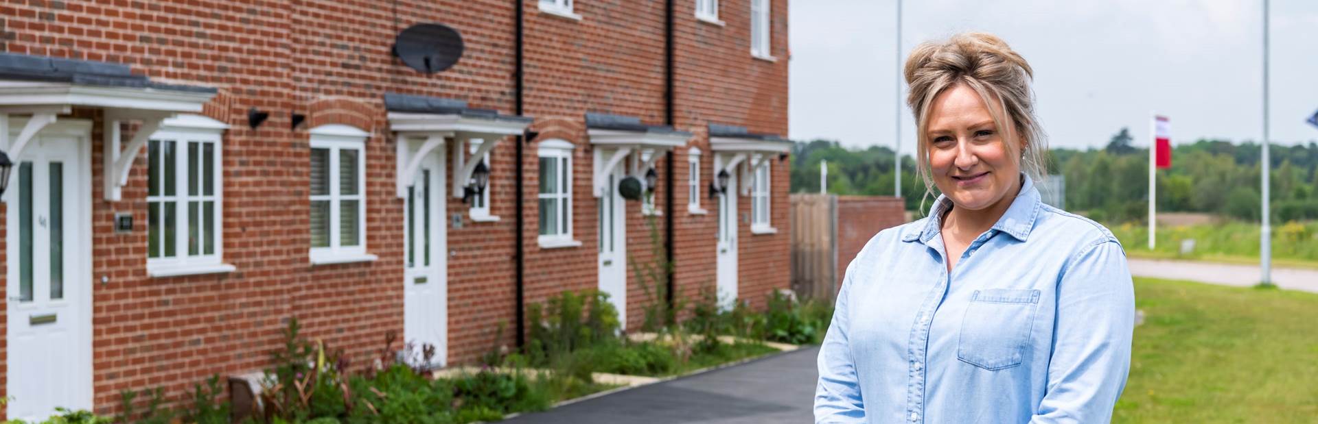 Person stood in front of houses