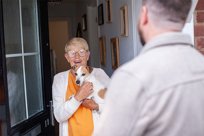 Woman at the door with her dog