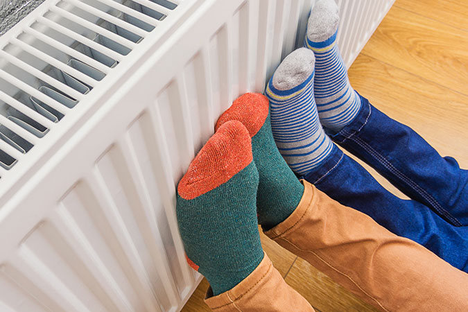 Image of feet on a radiator