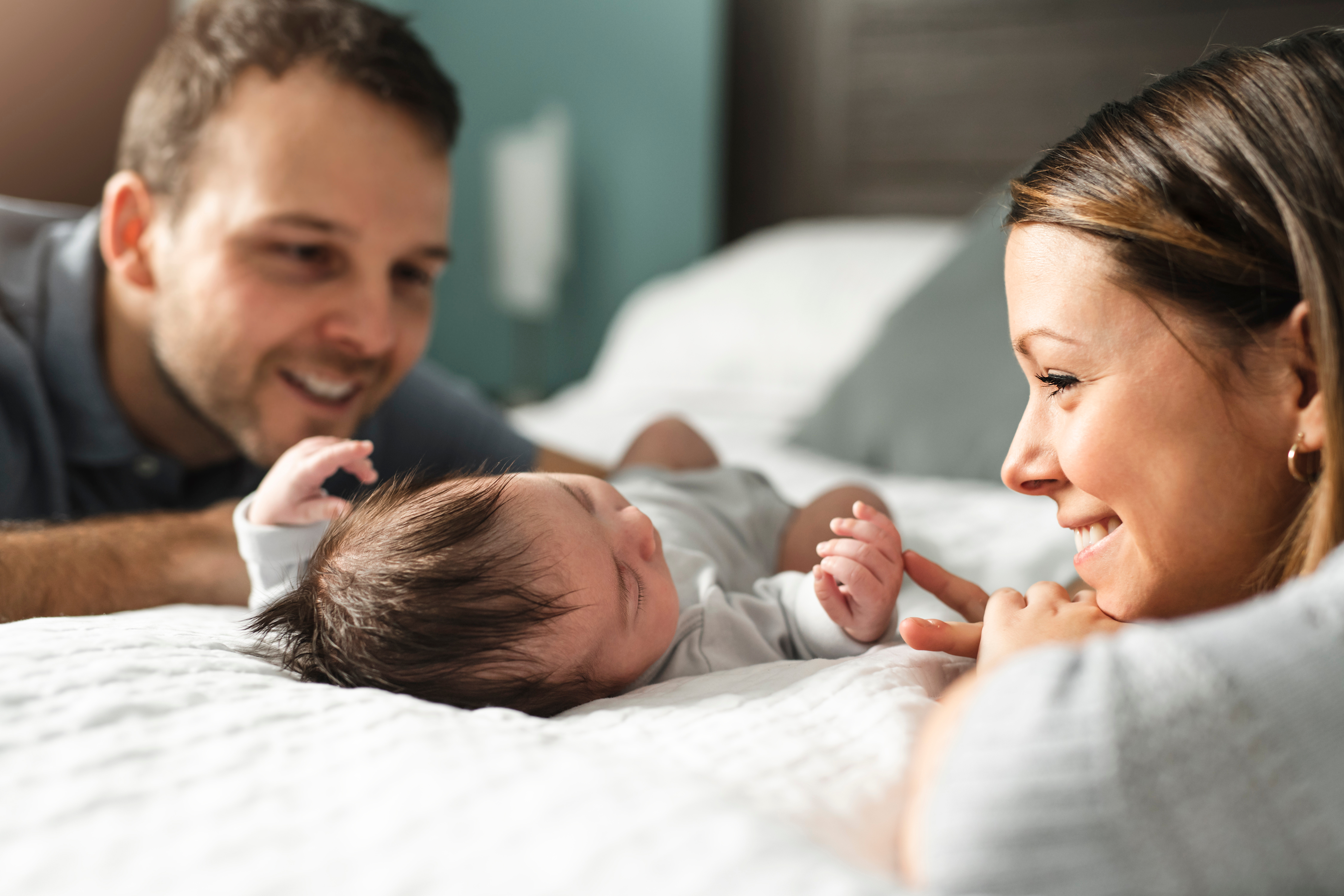 new parents with their newborn baby