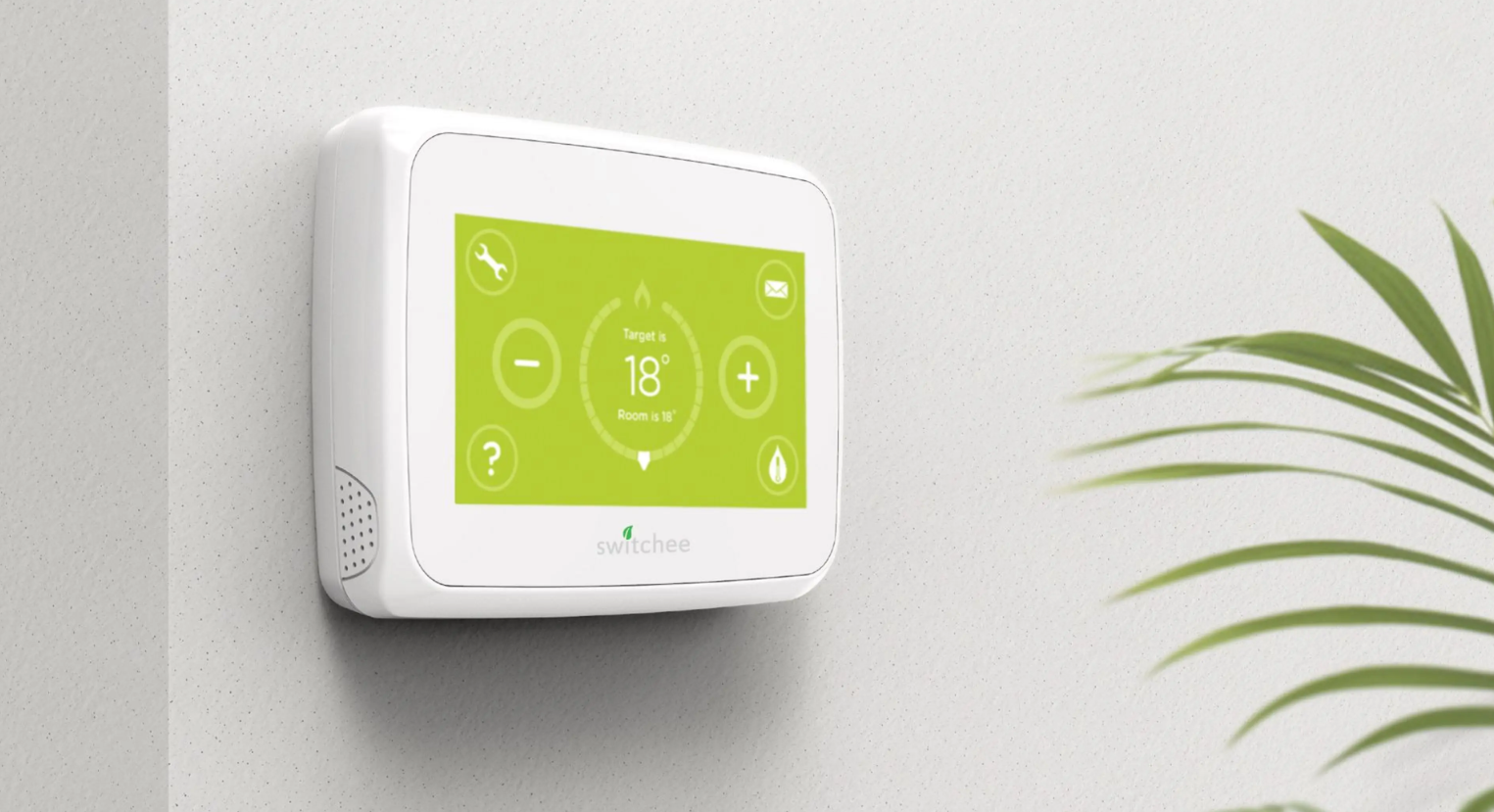 Switchee smart thermostat on a wall