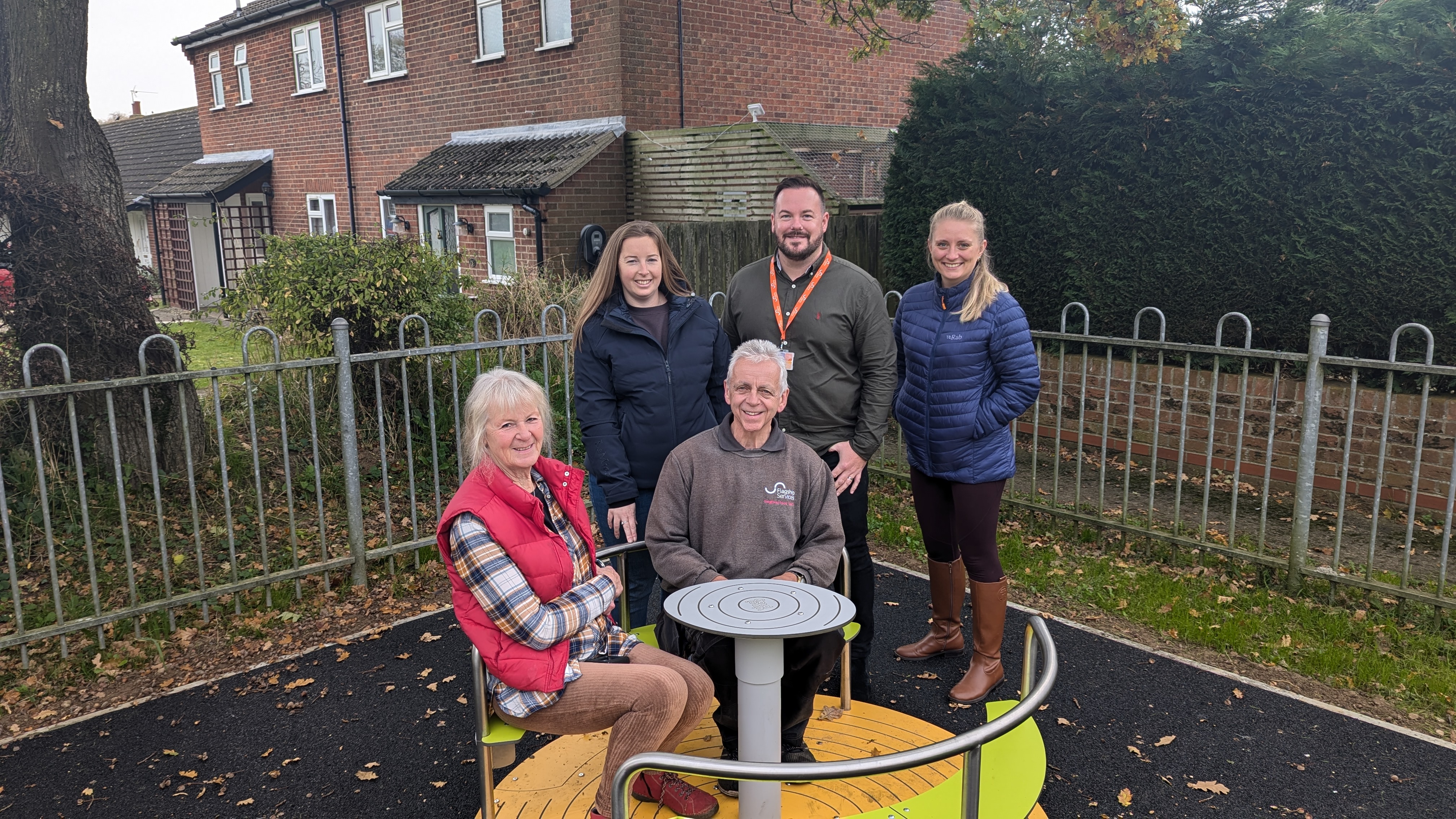 L-R: Parish councillor Tina Hooker and neighbourhood officer Neil Turner on the new roundabout, with local resident Charlotte Middleton, neighbourhood services manager Joe McNeill, and customer engagement and influence manager Emma Crampton
